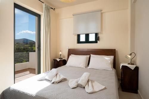Ένα ή περισσότερα κρεβάτια σε δωμάτιο στο Vidakis Villas 3