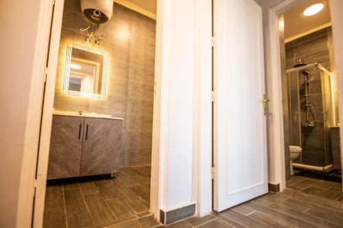 a bathroom with a shower and a sink and a toilet at El Gouna Elite Worldwide Sea & Garden Residences - Hurghada, Egypt in Hurghada