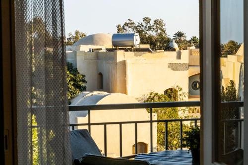 a view of a building from a balcony at El Gouna Elite Worldwide Sea & Garden Residences - Hurghada, Egypt in Hurghada