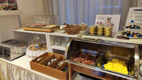 a buffet line with many different types of food at Albergo Italia in Urbino