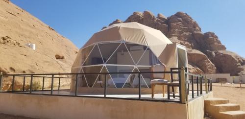 a dome house in the middle of the desert at Tower Rum Camb in Wadi Rum