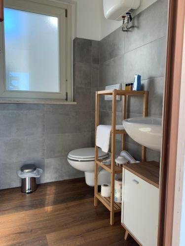 a bathroom with a toilet and a sink at Trastevere Studio Flat - Zen Real Estate in Rome