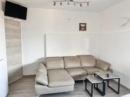 a living room with a couch and a table at Gruberhof in Pill