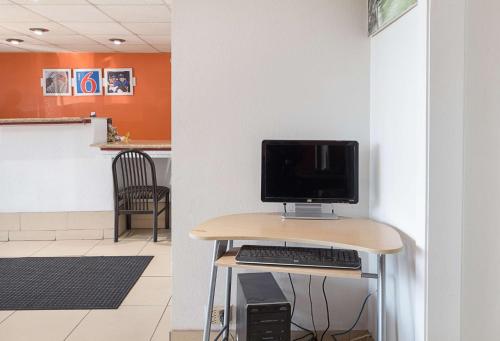 a computer sitting on a desk in a room at Motel 6 San Antonio TX I10 West in San Antonio