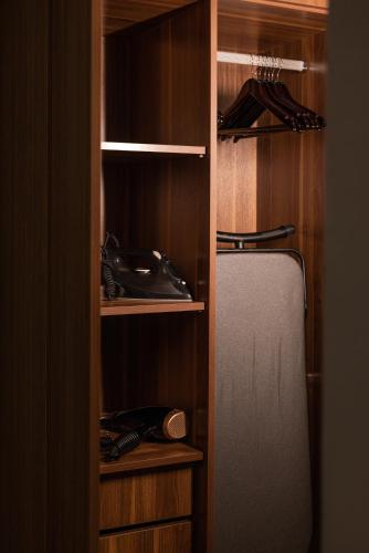 a walk in closet with a refrigerator in it at Elegant Seaview Projector Lounge by The Only Bnb in Tanjong Tokong