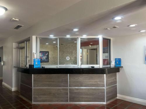 a lobby with a counter with a sink in a room at Suites Dallas TX Downtown in Dallas