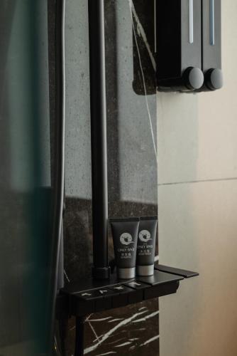 two coffee cups sitting on a shelf in a kitchen at Elegant Seaview Projector Lounge by The Only Bnb in Tanjong Tokong