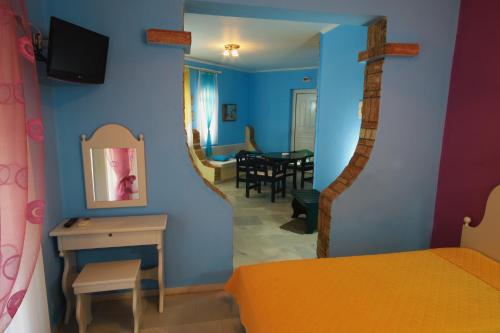 a room with a bed and a dining room at Heaven Apartments in Agia Marina Nea Kydonias