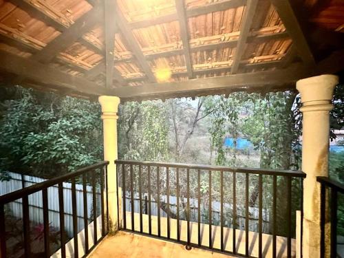 a screened in porch with a view of a yard at Waterfront Beach Villa In Baga with Private Pool in Baga