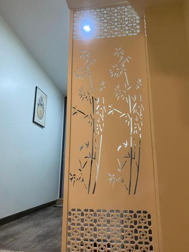 a door with bamboo stencils on it in a room at Chill Home 1 in Ho Chi Minh City
