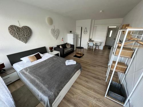 a bedroom with a bed and a bunk bed at KnocksCasa4You 1 Zimmer Appartement Nr 5 direkt in Marburg in Marburg an der Lahn