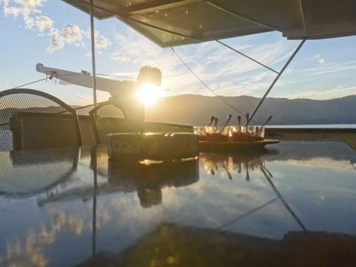 a reflection of the sun on a table on a boat at Motor Yacht Cadabra in Rab