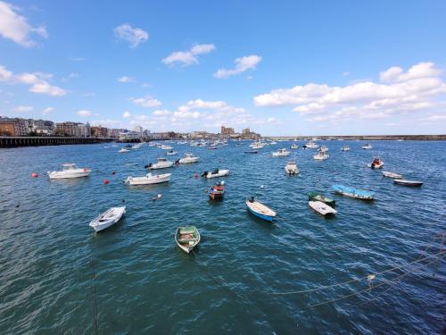 a group of boats in a large body of water at Casa Cantábrico in Castro-Urdiales