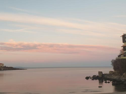 a lighthouse on the shore of a body of water at SAPPHIRE in Sozopol