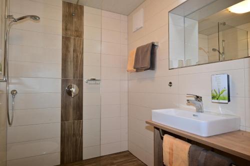 a bathroom with a sink and a shower at Zirbentraum in Biberwier