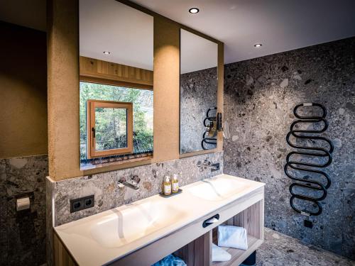 Salle de bains dans l'établissement HAUSEREI Design & Kräuterhotel
