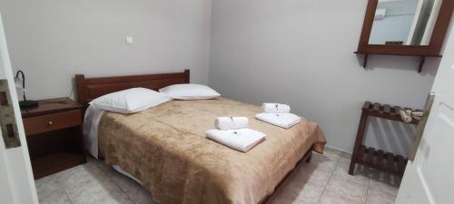 Vasilis Apartmentsにあるベッド