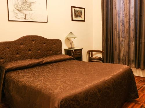 A bed or beds in a room at Casa Vacanze Scalone