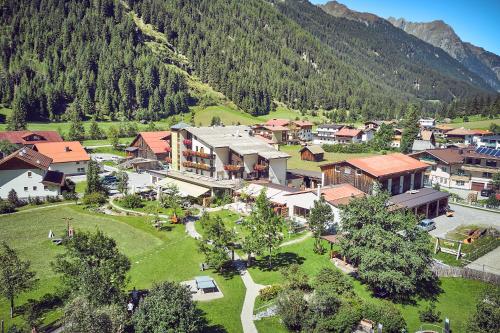 an aerial view of a village in the mountains at Bio Hotel Stillebach in Sankt Leonhard im Pitztal