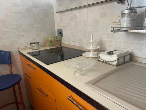 a kitchen with a sink and a counter top at La casa di Flora aeroporto di Fiumicino in Fiumicino