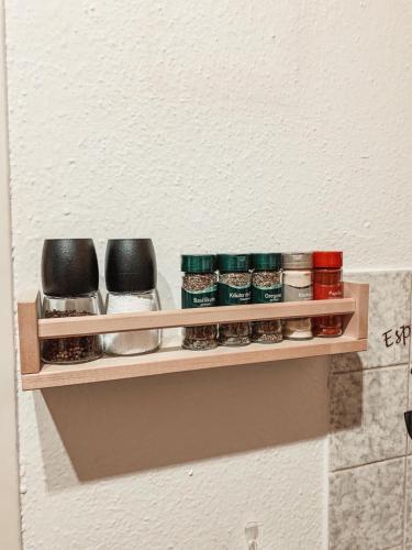 a shelf on a wall with spices on it at **TOP**GEMÜTLICH*BERGNAH*ZENTRAL*NETFLIX & RELAX* in Sonthofen
