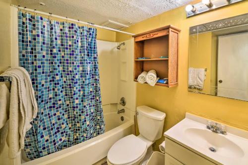 a bathroom with a toilet and a sink and a shower at Seaside Corpus Christi Condo at The Villa del Sol! in Corpus Christi