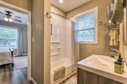 a bathroom with a sink and a shower at Remodeled Downtown Hot Springs Home with Porch! in Hot Springs