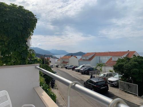 a balcony with cars parked in a parking lot at Studio apartment MAR 1 in Dubrovnik