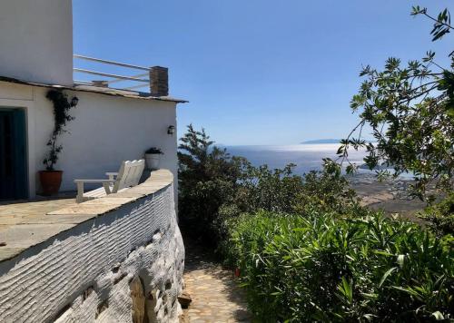 a house with a view of the ocean at Thimari cottage in Andros in Agios Petros