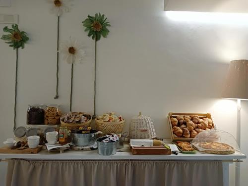 a table with food and other items on it at Hotel Petit in Silvi Marina