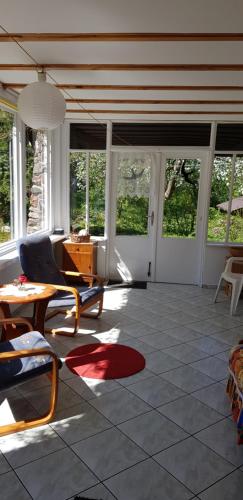 a living room with a couch and a table at Agroturystyka Lisa Młyn in Najmowo
