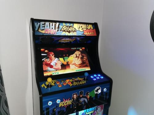a video game controller for a evil dead game at L'AisCal Appart-Hôtel 6 Personnes in Calais