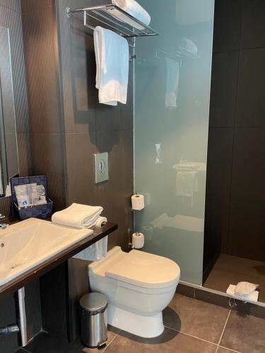 a bathroom with a toilet and a sink at Hotel 54 Barceloneta in Barcelona
