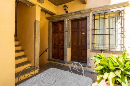 a table and chairs in front of a door at Agriturismo Edoardo Patrone in Domodossola