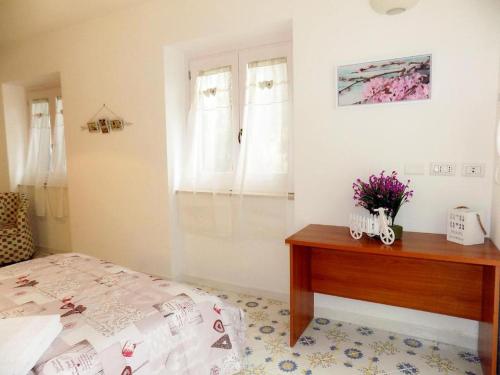 Кровать или кровати в номере L'orchidea amalfi coast