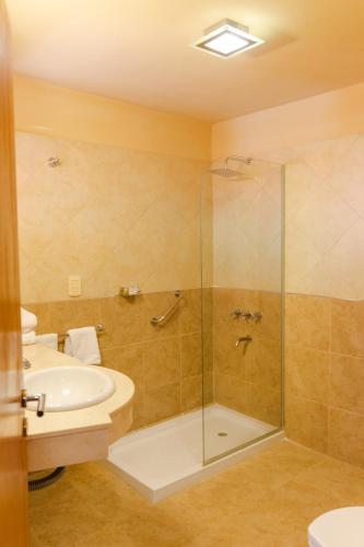 a bathroom with a shower and a sink at Colores de Purmamarca in Purmamarca