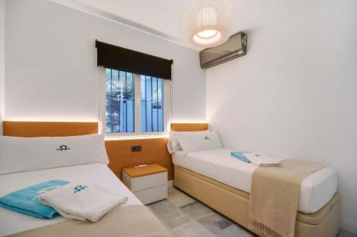 Postel nebo postele na pokoji v ubytování MARIA DEL MAR SEA APARTMENT