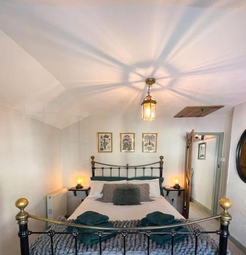 a bedroom with a large bed with a ceiling at *Stunning* The Botanist Rest Ventnor IOW in Ventnor
