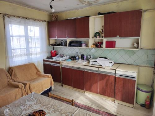 a kitchen with a counter and a chair in a room at Our Village in Ashtarak
