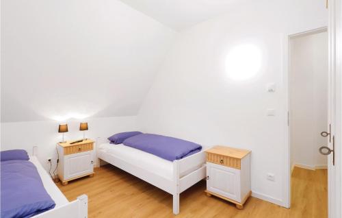 Ένα ή περισσότερα κρεβάτια σε δωμάτιο στο Reetdachhaus Moin-Moin