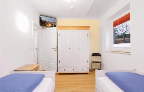 Ένα ή περισσότερα κρεβάτια σε δωμάτιο στο Reetdachhaus Moin-Moin