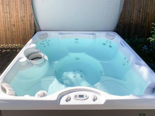a bath tub with an elephant in it at Bohemian Bungalow with Hot Tub in Winooski