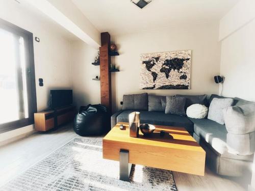 a living room with a couch and a coffee table at The Beehive in Mytilini