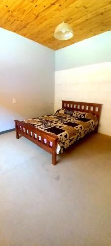 Ένα ή περισσότερα κρεβάτια σε δωμάτιο στο Hostel Paraíso