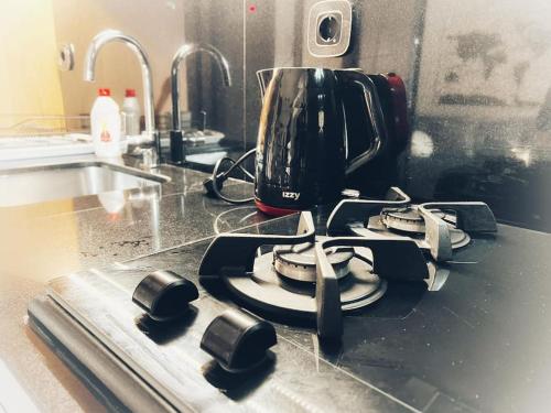 a coffee pot on a stove in a kitchen at The Beehive in Mytilini