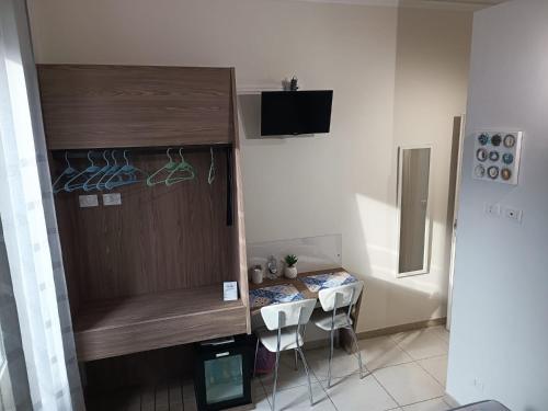 Televízia a/alebo spoločenská miestnosť v ubytovaní B&B AMISTANZA