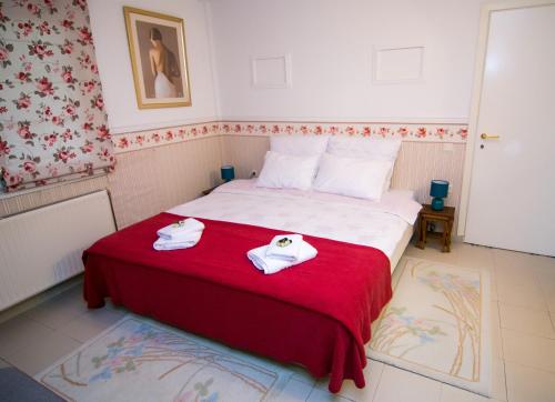 a bedroom with a bed with two towels on it at Luxury Chez-Moi in Serres