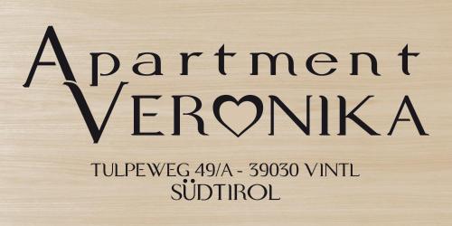 a wooden sign with the words permanent vermiculum at Apartment Veronika in Vandoies