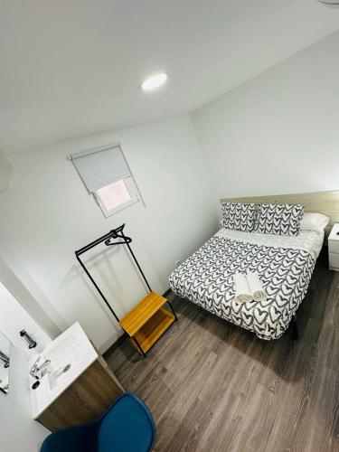 Postel nebo postele na pokoji v ubytování HOSPEDAJE NUEVA NUMANCIA