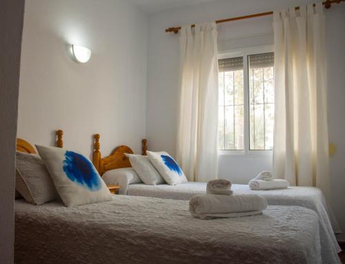 Кровать или кровати в номере Apartamentos Bellavista Bolonia